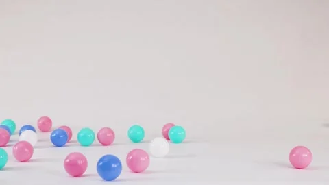 Colorful Plastic Balls Falling and Bouncing on a White Surface 스톡 동영상 328488371