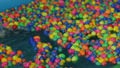Colorful Plastic Balls Floating in Blue Water Pool Stock Footage 341852246