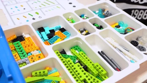 Colorful plastic blocks in white box. Children toys for playing, building object Stock Footage 167214924