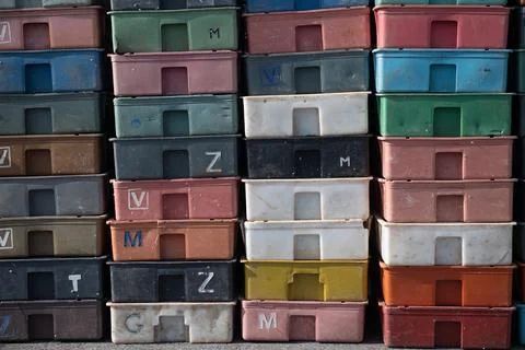 Colorful plastic boxes in grid pattern for efficient warehouse storage 写真素材