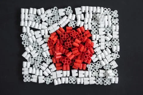 Colorful plastic bricks that form the flag of Japan on the background of blac Stock Photos