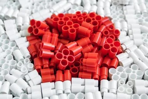 Colorful plastic bricks that form the flag of Japan on the background of blac Stock Photos