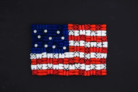 Colorful plastic bricks which form the US flag on black paper background. Par Stock Photos
