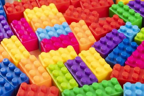 Colorful plastic building block patterns isolated. Toy for children Stock Photos
