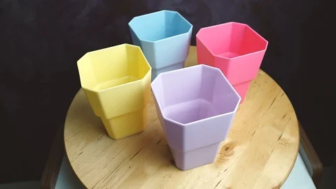 Colorful plastic cups on the table. Rotation. Closeup 스톡 동영상 107737521