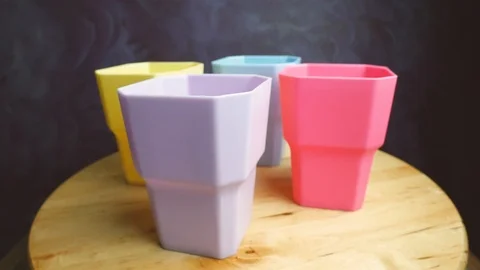 Colorful plastic cups on the table. Rotation. Closeup Stock-Footage 107737734