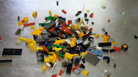 Colorful plastic designer at the table, building kit Stock Footage 89036305