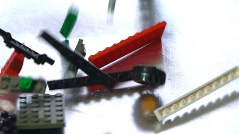 Colorful plastic designer at the table, building kit, slow motion Video stock 89038169