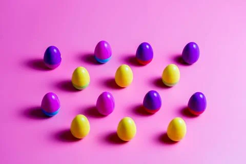Colorful Plastic Easter Eggs on pink background Foto stock