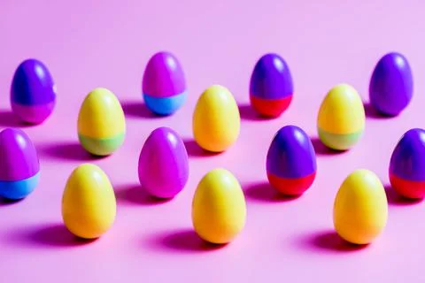 Colorful Plastic Easter Eggs on pink background Foto stock