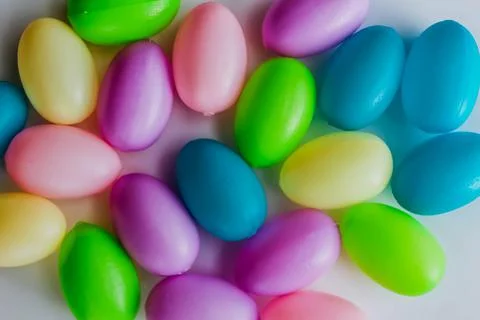Colorful plastic Easter eggs on white. Holiday concept. Sprint bright Stock Photos