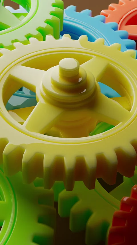 Colorful plastic gears rotating in a smooth, endless loop. Stock Footage 314044332