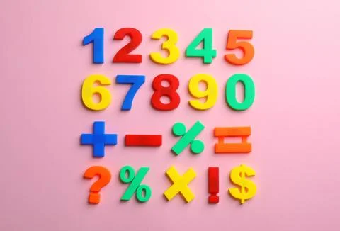 Colorful plastic magnetic numbers on color background, top view Stock Photos