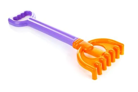 Colorful plastic rake Stock Photos