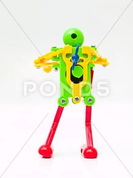 A colorful plastic robot in back view Stock Photos