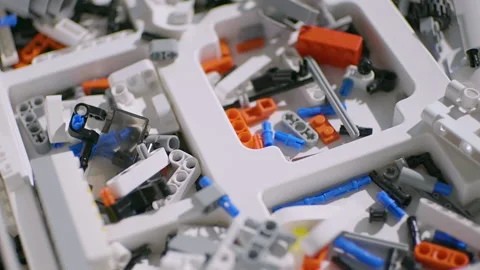 Colorful plastic toy blocks of the constructor falling into the box. Slow motion Stock Footage 150332088