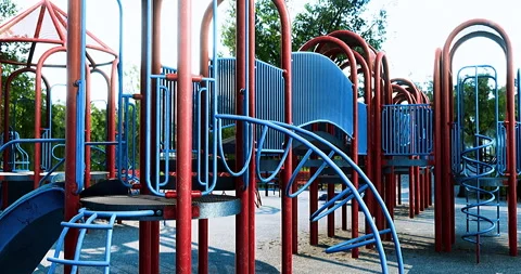 Colorful playground structures invite play and creativity in a sunny setting Stock Footage 320526015