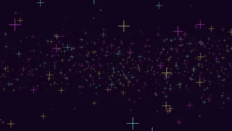 Colorful plus sign particles flying across dark background in abstract motion Stock-Footage 334139498
