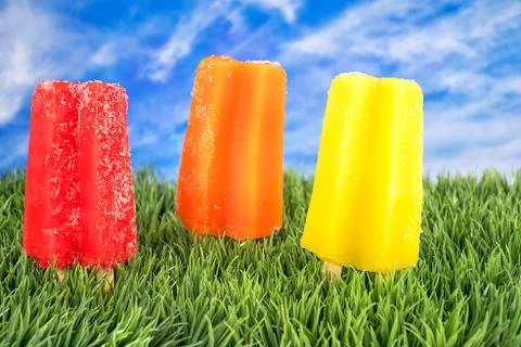 Colorful popsicles grass Stock Photos
