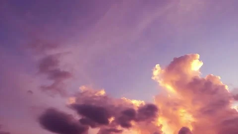 Colorful purple yellow clouds on dramatic sunset magenta blue sky Stock Footage 156795365