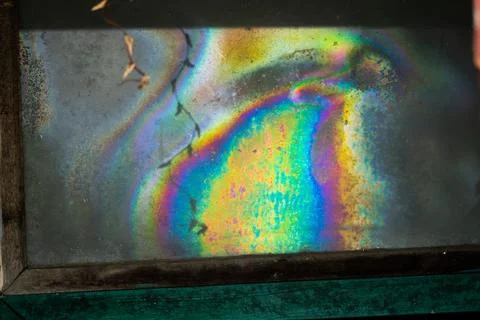 A colorful rainbow is reflected in a window Foto stock