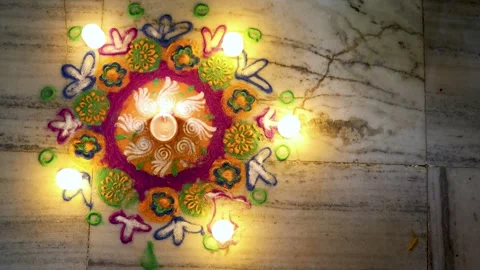 Colorful rangoli pattern with lit candles for diwali festival at outdoor Stock Footage 317228245