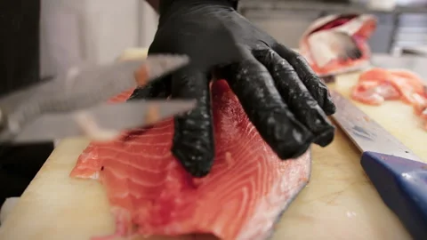 Colorful Raw Fish Cleaning With Scissors Stock Footage 287040697
