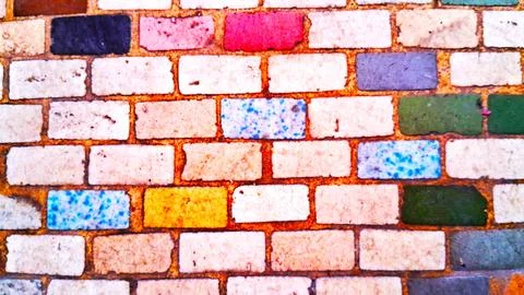 Colorful rectangular bricks arranged in a vibrant repeating wall pattern design Stock Photos