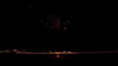 Colorful red fireworks exploding late at night on the street Stock Footage 127374708