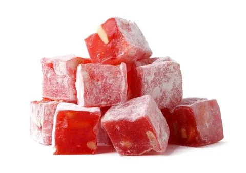 Colorful red fruit candy cubes stacked on a white background display playful 库存照片