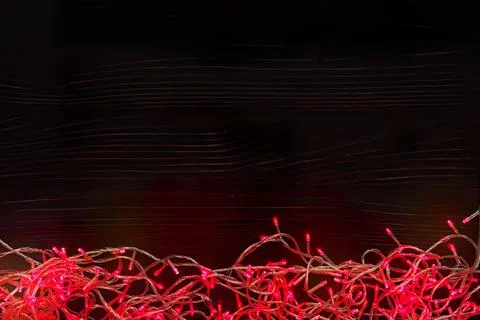 Colorful red light strings on black background 스톡 사진
