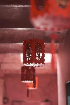 Colorful red lights with hieroglyphs in the premises of a Buddhist temple Stock Photos