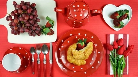 Colorful red theme breakfast brunch table setting flatlay stop motion. Stock Footage 112912399