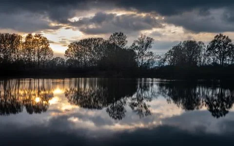 Colorful reflections of trees on the river Foto stock