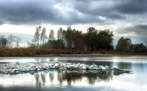 Colorful reflections of trees on the river Foto stock