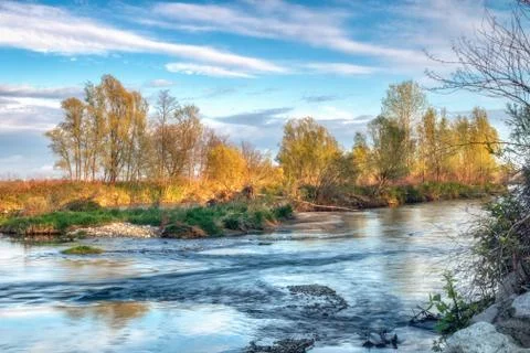 Colorful reflections of trees on the river Foto stock
