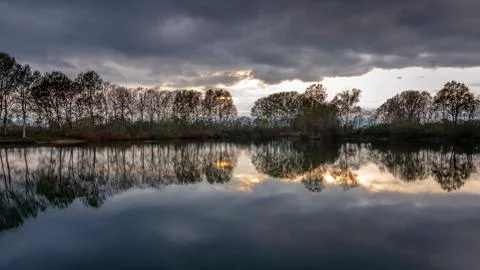 Colorful reflections of trees on the river Foto stock