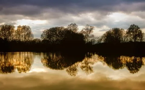 Colorful reflections of trees on the river Foto stock