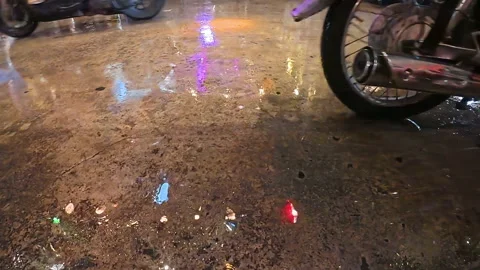 Colorful reflections on wet pavement creating abstract patterns Stock Footage 305069010