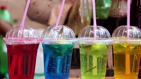 Colorful Refreshing Fruit Beverages in Transparent Cups with Straws and Vib.. Vídeo Stock 346729836