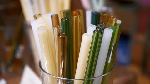 Colorful Reusable Plastic Drinking Straws in Glass Jars in Eco Store Stock Footage 125119627
