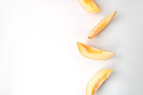Colorful ripe fruit pattern of melon slices on white background. Summer fruit Foto stock