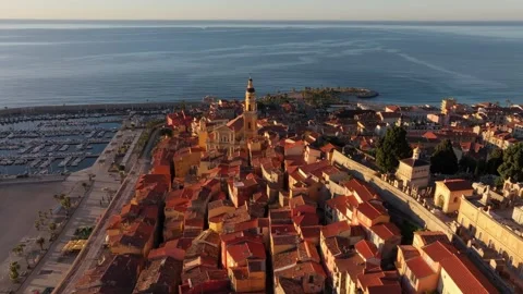 Colorful rooftops and sunset beach in historic Menton old town, France Vídeos de archivo 310327519