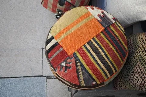 Colorful round cushion with patchwork design on display Stock Photos