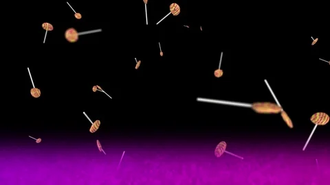 Colorful round lollipops falling downwards over dark background with purple Stock Footage 345101960