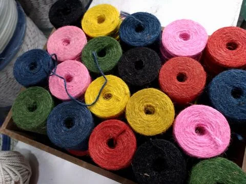 Colorful rounded spools are in a box Stock Photos