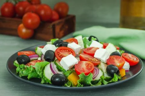 Colorful salad vegetable on dark background. Salad vegetable. Tasty meal. Hea Stock Photos