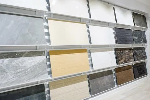 Colorful samples of a stone tile in store. Marble and granite flooring a mo.. Stock Photos