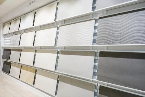Colorful samples of a stone tile in store. Marble and granite flooring a mo.. Stock Photos