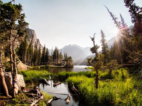 Colorful scene of alpine lake at sunset in the Rockies. Stock Photos